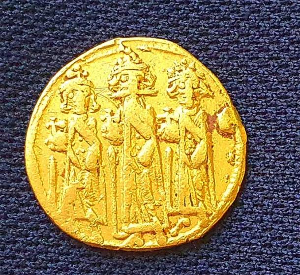 The gold coin unearthed in the excavation was minted in either 638 or 639 AD, when ancient Palestine was part of the Byzantine empire ruled by Emperor Heraclius. (Amir Gorzalczany / Israel Antiquities Authority)