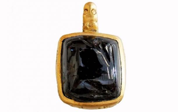 The gold pendant discovered at Great Tey measures 10.3 millimeters by 9.1 millimeters by 7.2 millimeters (0.4 inches by 0.3 inches by 0.28 inches). (Surrey County Council)