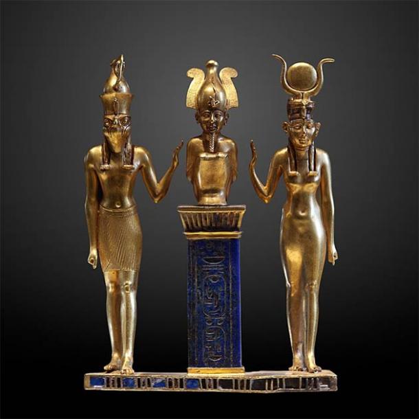 The family of Osiris: Osiris on a lapis lazuli pillar in the middle, flanked by Horus on the left and Isis on the right (Louvre Museum / CC BY-SA 2.0 FR )