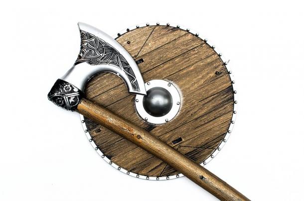 The most iconic of Viking weapons was the battle axe. Pictured: representation of Viking style axe and round shield. (Dmitriy / Adobe stock)
