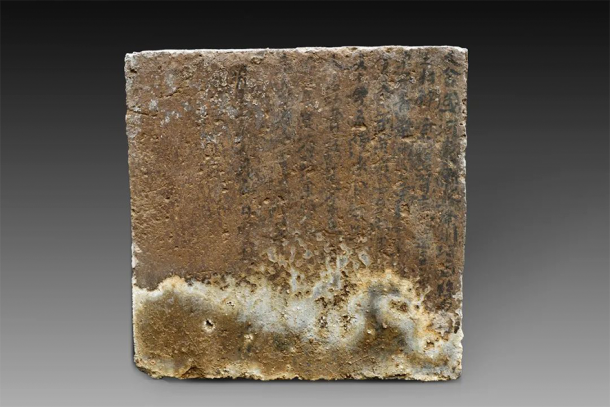 A land purchase document which is a square brick with writing that can be seen on the front, most of which is blurred. From the upper right, only part of the words "Wang Village, Yuanqu County, Jiangzhou, Jiangzhou, South East Road, Dajin Kingdom... Name of Gongcao... Mingchang..." and other parts of the text can be discerned. (Shanxi Provincial Institute of Archaeology)