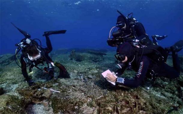 Researchers taking measurements at one of the wreck sites. (Greek Ministry of Culture)