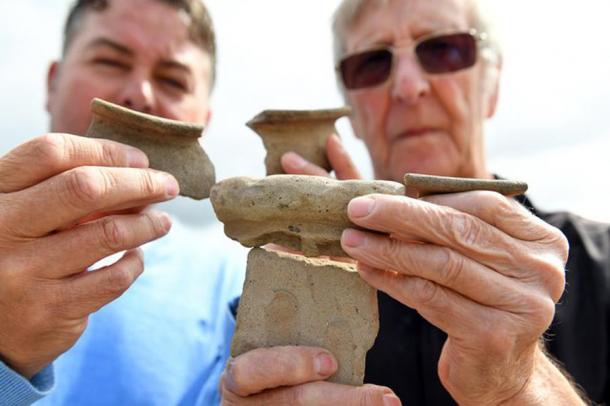 The pair of metal-detectorists, Lee McGowan (left) and Peter Beasley with items from a previous find. (Malcolm Wells)