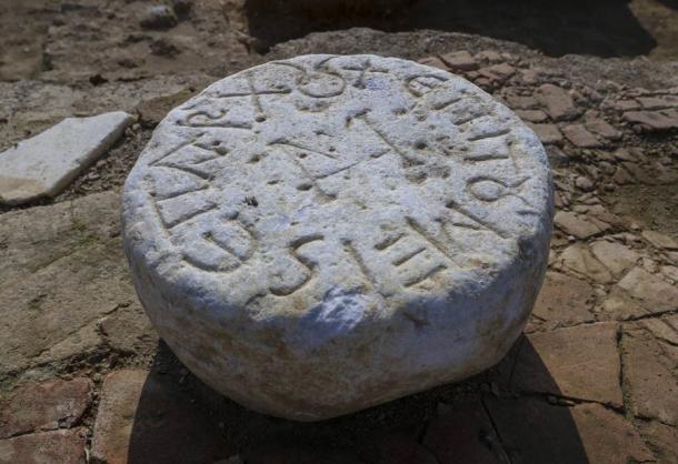 A pedestal inscribed in Greek, which likely was part of a mausoleum, found at the huge train station dig in Istanbul. (Anadolu Agency)