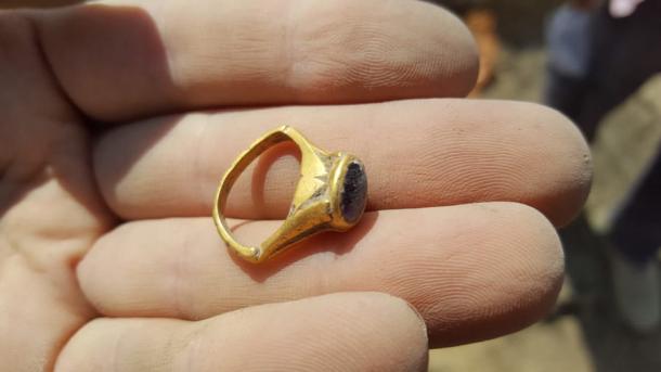 The precious stone ring as it was found in central Israel and its amethyst stone, which was said to be a cure for hangovers.  Source: Israel Antiquities Authority