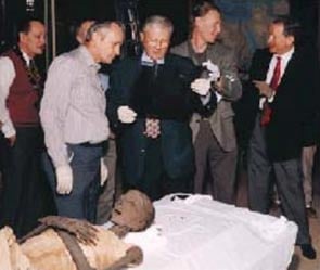 A team of experts, including (from left) BYU professor C. Wilfred Griggs, Utah county medical doctors Bruce Mcliff and Richard Jackson, and San Jose, Calif., doctor Grady Jeeter, examines the mummy in which Griggs discovered a 9-inch iron knee pin. Courtesy of Rosicrucian Egyptian Museum.