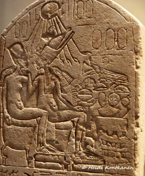 The controversial, unfinished stele dedicated by Pasi/Pay shows two Amarna kings in an affectionate pose—long thought to depict Akhenaten and Nefertiti in her “quasi-kingly” status, wearing the double crown of Egypt. Neues Museum, Berlin.